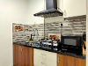 One Bedroom unit Kitchen of Plot 31 TrustedStay Service Apartment in Gachibowli Hyderabad